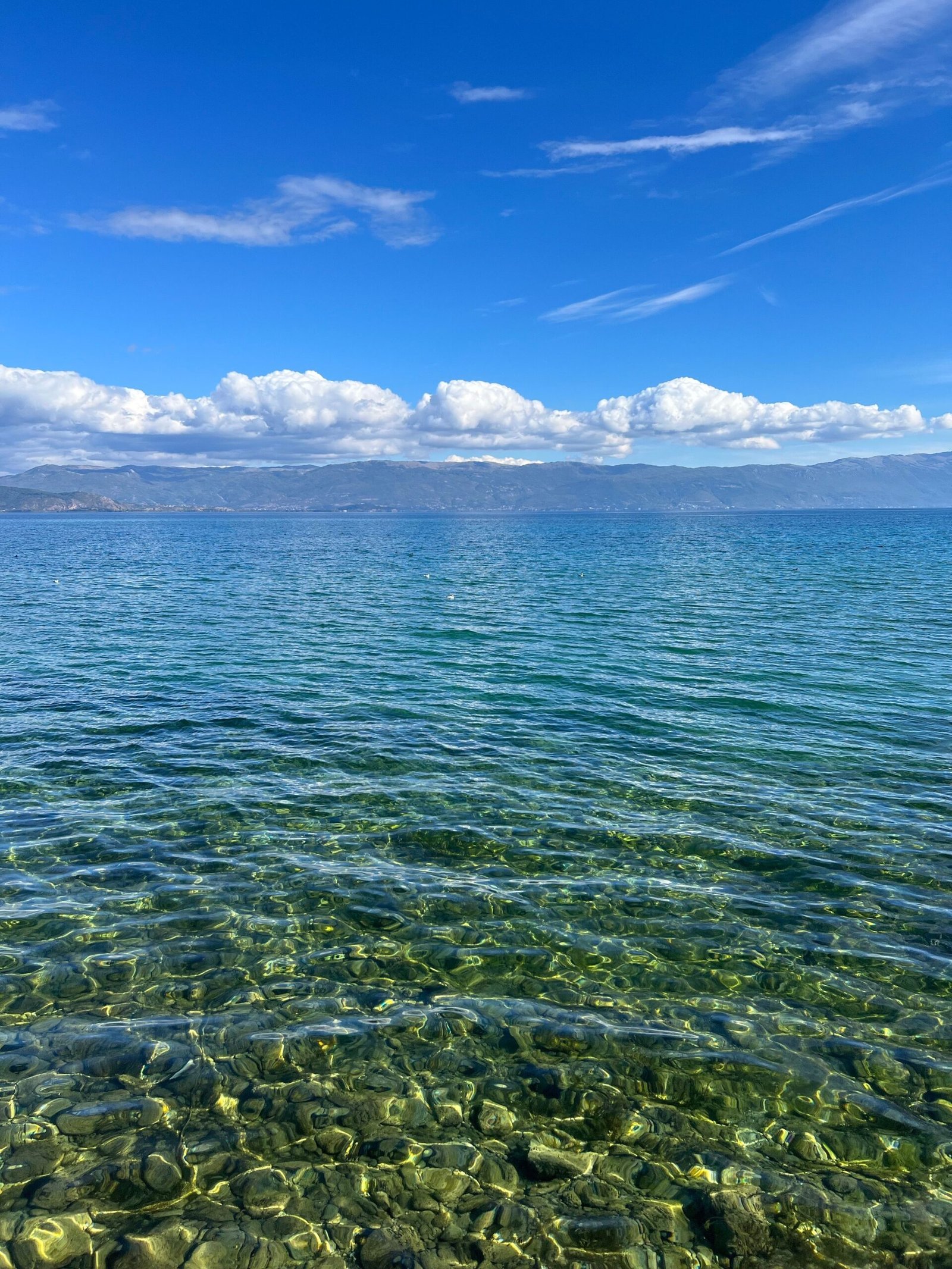Boats on the clear blue water of Lake Ohrid, North Macedonia
