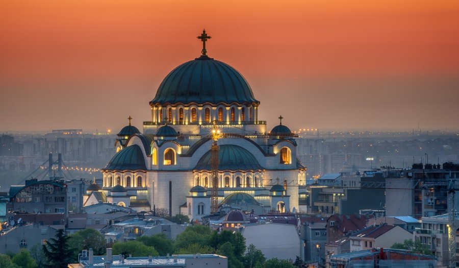 White marble Temple of St. Sava with green domes in Belgrade, Serbia